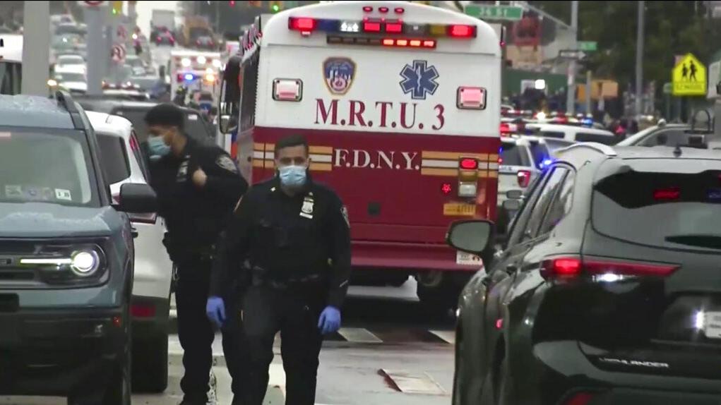 At least 16 people have been injured in a shooting at a Brooklyn subway station, and the suspect is being sought.