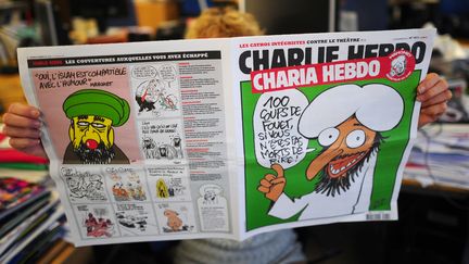 La une de "Charlie Hebdo", rebaptis&eacute; "Charia Hebdo", le 1er novembre 2011.&nbsp; (MARTIN BUREAU / AFP)