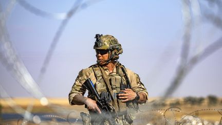 A US soldier patrols in al-Qahtaniyah, northeastern Syria, on June 14, 2023. (DELIL SOULEIMAN / AFP)