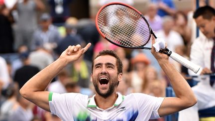 L'exultation de Marin Cilic après avoir s'être ouvert les portes de la finale de l'US Open 2014 en s'offrant Roger Federer le 7 septembre 2014. (STAN HONDA / AFP)