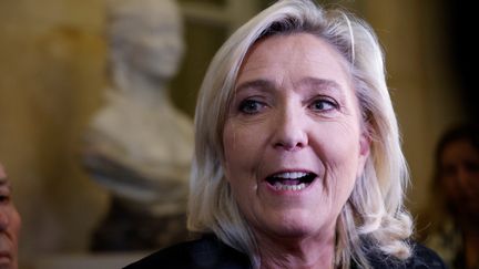 Marine Le Pen speaks after the rejection of the vote on the immigration bill by the National Assembly, Monday December 11.  (LUDOVIC MARIN / AFP)