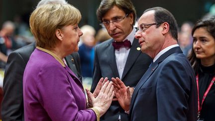 La chanceli&egrave;re allemande,&nbsp;Angela Merkel, le Premier ministre belge,&nbsp;Elio&nbsp;Di Rupo, et Fran&ccedil;ois Hollande, le 15 mars 2013 &agrave; Bruxelles (Belgique). (GEERT VANDEN WIJNGAERT/AP/SIPA / AP)