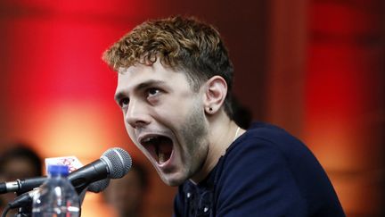 Le r&eacute;alisateur Xavier Dolan, lors d'une conf&eacute;rence de presse, &agrave; Montr&eacute;al (Canada), le 26 mai 2014.&nbsp; (CHRISTINNE MUSCHI / REUTERS)