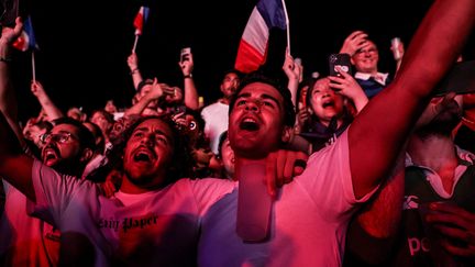 Fans caught fire in the Paris fan zone, Place de la Concorde, after France's victory over New Zealand.  (what is the reason)