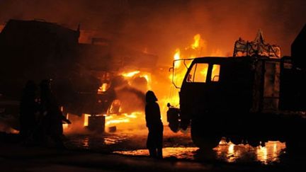 Attentat contre un convoi de l'Otan près d'Islamabad, au Pakistan, le 09 juin 2010 : sept morts (AFP/AAMIR QURESHI)