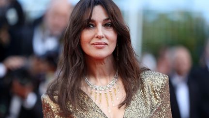 Monica Bellucci, la maîtresse de cérémonie pour l'ouverture du festival le 18 mai, revient sur le tapis rouge pour le 70e anniversaire, qui réunit en une soirée tout le gratin du cinéma mondial. 
 (Valéry Hache / AFP)