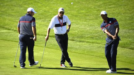 Patrick Reed et Tiger Woods alignés ensemble en Ryder Cup (ERIC FEFERBERG / AFP)