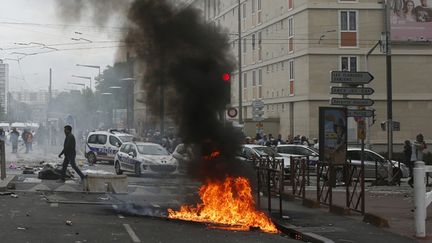  (A Sarcelles le 20 juillet © REUTERS / Benoit Tessier)