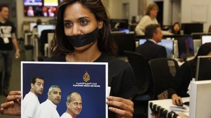 Protestations contre l'emprisonnement de trois journalistes d'Al Jazeera, le 25 septembre à New York. (THOS ROBINSON / GETTY IMAGES NORTH AMERICA / AFP)