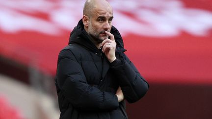 Pep Guardiola sur le banc de Manchester City (IAN WALTON / POOL)