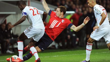 Eric Abidal face à Nolan Roux (PHILIPPE HUGUEN / AFP)