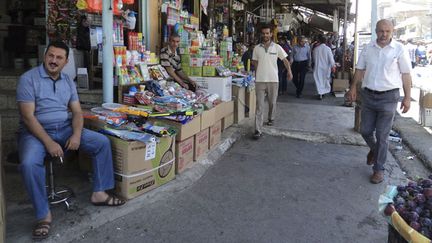 &nbsp; (Un marché au centre de Bagdad © Reuters)