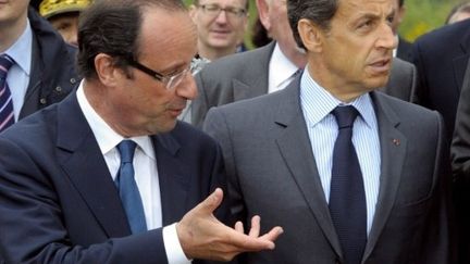 François Hollande et Nicolas Sarkozy lors d'une visite en Corrèze en avril 2011. (AFP - Philippe Wojazer)