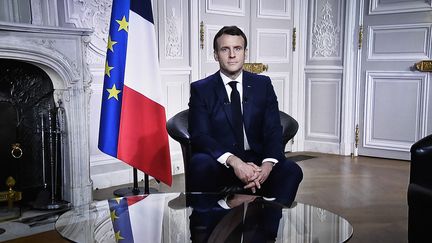 Emmanuel Macron lors de son allocution aux Français le 31 décembre 2020 (STEPHANE DE SAKUTIN / AFP)