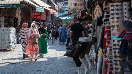 Passers-by on a street in Istanbul, July 1, 2021 in Türkiye.  (DIEGO CUPOLO / NURPHOTO / AFP)