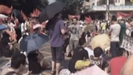 Manifestation à Jiangmen, en Chine, contre le projet de construction d'une usine de retraitement d'uranium (capture d'écran). (NTDTV)