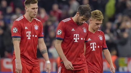 La déception des joueurs du Bayern (GUENTER SCHIFFMANN / AFP)