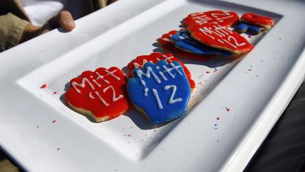 Une supportrice de Mitt Romney et ses g&acirc;teaux, Floride, 28 janvier 2012. (BRIAN SNYDER / REUTERS)