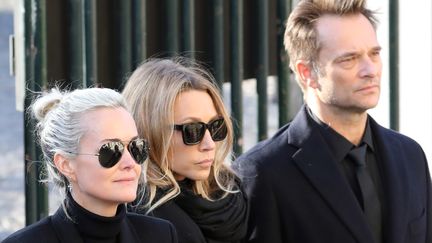 Laeticia Hallyday, Laura Smet et David Hallyday, lors de l'hommage national rendu à Johnny Hallyday, le 9 décembre 2017.&nbsp; (LUDOVIC MARIN / AFP)