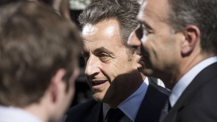 Nicolas Sarkozy lors de son arriv&eacute;e au si&egrave;ge de l'UMP, &agrave; Paris, le 8 juillet 2013. (FRED DUFOUR / AFP)