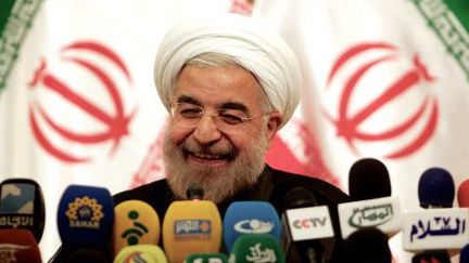 Sourire du nouveau président iranien, Hassan Rohani, en juin 2013 à Téhéran. (BEHROUZ MEHRI / AFP)