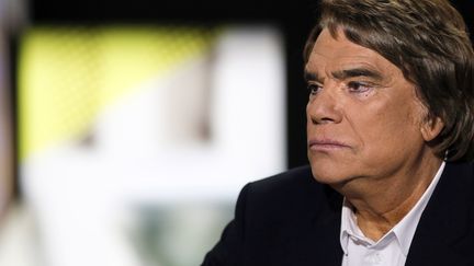 Bernard Tapie, sur la cha&icirc;ne i-T&eacute;l&eacute;, le 10 juillet 2013. (FRED DUFOUR / AFP)