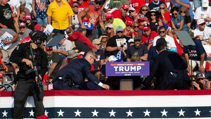 Secret Service agents intervene after Donald Trump was shot at a rally in Butler, Pennsylvania, United States, on July 13, 2024. (REBECCA DROKE / AFP)