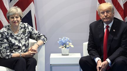 La Première ministre britannique, Theresa May, et le président des Etats-Unis, Donald Trump, lors du sommet du G20 à Hambourg (Allemagne), le 8 juillet 2017. (SAUL LOEB / AFP)