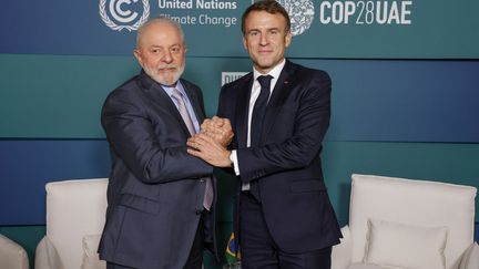 Brazil's President Luiz Inacio Lula da Silva and President Emmanuel Macron at COP28 in Dubai on December 2, 2023. The two leaders disagree on negotiations for the major Europe-wide trade deal and South America.  (LUDOVIC MARIN / AFP)