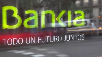 «Pour un futur commun» : la banque espagnole Bankia, partiellement nationalisée, annonce la couleur dans un pays miné par un système bancaire défaillant. (AFP PHOTO/MANUEL COHEN)