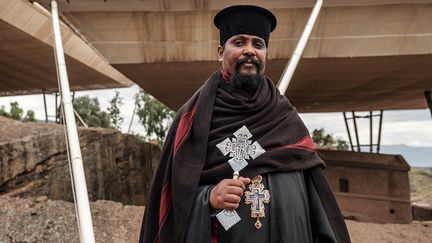 "Nous voulons une restauration permanente et nous voulons que l'abri soit retiré", déclare Tsigieselassie Mazgebu, le curé de la paroisse du site. (EDUARDO SOTERAS / AFP)