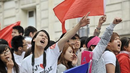 Manifestation de Chinois ou de personnes d'origine chinoise dans les rues de Belleville à Paris (20 juin 2010) (AFP/BERTRAND LANGLOIS)