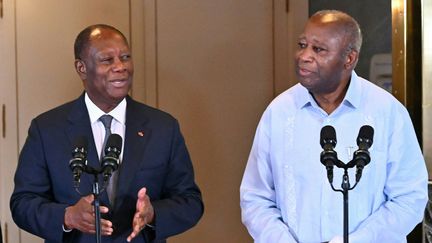 Alassane Ouattara et&nbsp;Laurent Gbagbo, le 14 juillet 2022 à Abidjan en&nbsp;Côte d'Ivoire. (ISSOUF SANOGO / AFP)