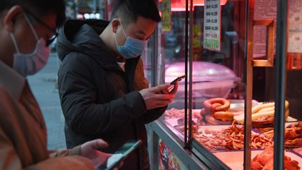 Pékin au rythme du coronavirus Covid-19 (photo d'illustration). (GREG BAKER / AFP)