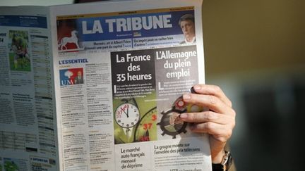 Lecteur de La Tribune (AFP/Thomas Coex)