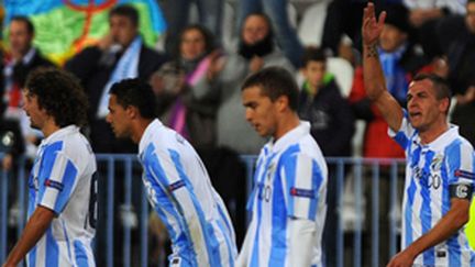 Les joueurs de Malaga protestent (JORGE GUERRERO / AFP)