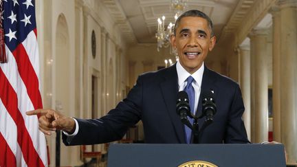 Barack Obama, le 20 novembre 2014, lors de son intervention t&eacute;l&eacute;vis&eacute;e de la Maison blanche, &agrave; Washington. (JIM BOURG / AFP)