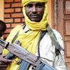 Un combattant de la S&eacute;l&eacute;ka pose avec son arme, &agrave; Bangui (Centrafrique), le 25 juillet 2013. (XAVIER BOURGOIS / AFP)