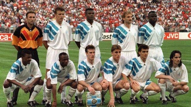 To face AC Milan, favorites in this final of the European Cup of Champions Clubs, OM coach Raymond Goethals decided to rely on a dense 5-2-3 system.  Standing, from left to right: Fabien Barthez, Franck Sauzée, Marcel Desailly, Rudi Völler, Basile Boli.  Squatting, from left to right: Jocelyn Angloma, Abedi Pelé, Didier Deschamps, Alen Boksic, Jean-Jacques Eydelie and Eric Di Meco.  (GEORGES GOBET / AFP)