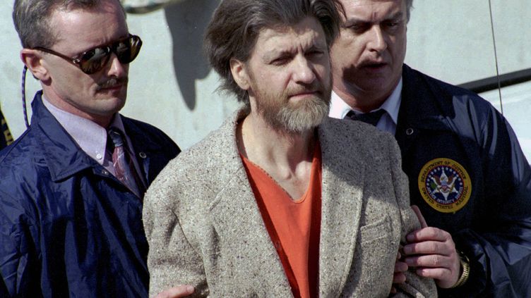 Ted Kaczynski escorted by federal agents, April 4, 1996, as he heads to Montana federal court in Helena.  (JOHN YOUNGBEAR/AP/SIPA)