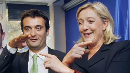 Florian Philippot et Marine Le Pen lors de la présentation de l'équipe de campagne pour les élections présidentielles de 2012, le 6 octobre 2011 à Nanterre (Hauts-de-Seine). (JACQUES BRINON / AP / SIPA)