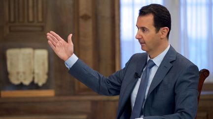 Le pr&eacute;sident syrien Bachar Al-Assad, le 26 mars 2015 &agrave; Damas (Syrie), lors de l'interview qu'il a accord&eacute;e &agrave; la cha&icirc;ne am&eacute;ricaine CBS. ( SANA / AFP)