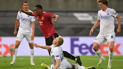 Continuant sur la lancée de sa fin de saison, Anthony Martial a longtemps buté sur Karl-Johan Johnsonn avant de sauver Manchester United en 1/4 de finale contre Copenhague en provoquant un penalty transformé par Bruno Fernandes (SASCHA STEINBACH / POOL)