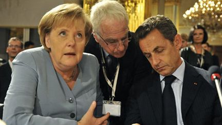 Nicolas Sarkozy et Angela Merkel, à Bruxelles, au huitième sommet Asie-Europe, le 4/10/2010 (AFP/Georges Gobet)