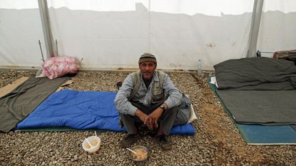 La plupart d'entre eux vivaient à l'ouest de la ville, un quartier détruit par les bombardements aériens. «Nous voulons des dédommagements pour les propriétés que nous avons perdues (...). Nous voulons rentrer au Soudan, mais pas les mains vides», disent-ils. (Ahmad GHARABLI / AFP)