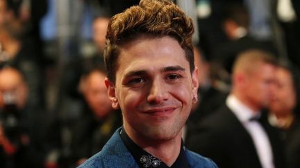 Xavier Dolan lors de la montée des marches pour son film "Mommy".
 (Loïc Venance / AFP)