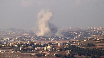 Smoke billows after an Israeli strike on the village of Kfar Tibnit, southern Lebanon, October 13, 2024. (AFP)