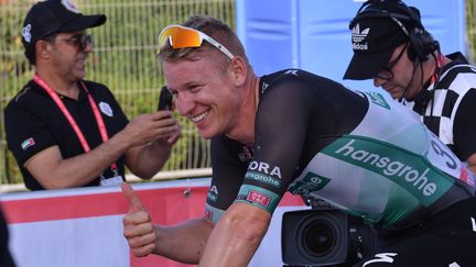 L'Allemand Pascal Ackermann tout sourire (GIUSEPPE CACACE / AFP)