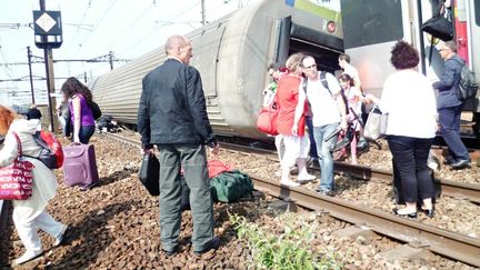 L'accident de Br&eacute;tigny-sur-Orge (Essonne) a fait 7 morts, le 13 juillet 2013. (A. J. CASSAIGNE / AFP)