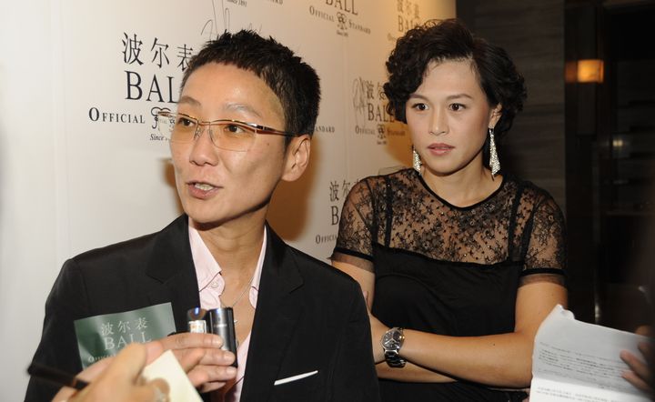 Gigi Chao (D), et sa petite amie Sean Yeung, &agrave; P&eacute;kin (Chine), le 20 septembre 2012. ( AFP )